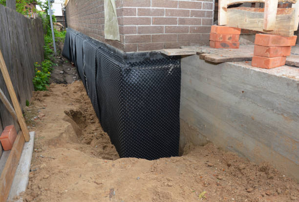 Happy homeowners after waterproofing job in Glouster